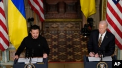 President Joe Biden and Ukrainian President Volodymyr Zelenskyy hold a news conference in the Indian Treaty Room in the Eisenhower Executive Office Building on the White House Campus, Dec. 12, 2023, in Washington.