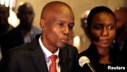 FILE - Jovenel Moise addresses the media next to his wife, Martine, after winning 55.67 percent of the vote in the Nov. 20 presidential election, according to the electoral council, in Port-au-Prince, Haiti, Nov. 28, 2016.
