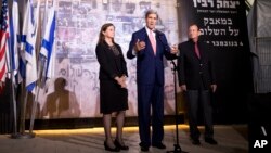 Secretary of State John Kerry, accompanied by Dalia Rabin-Pelossof, daughter of assassinated Israeli Prime Minister Yitzhak Rabin and Tel Aviv Mayor Ron Huldai, speaks at the site of Rabin's death after a wreath laying in Tel Aviv, Nov. 5, 2013. 