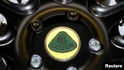 FILE - The Lotus logo is seen during the first press day of the Paris auto show, in Paris, France, Oct. 2, 2018.