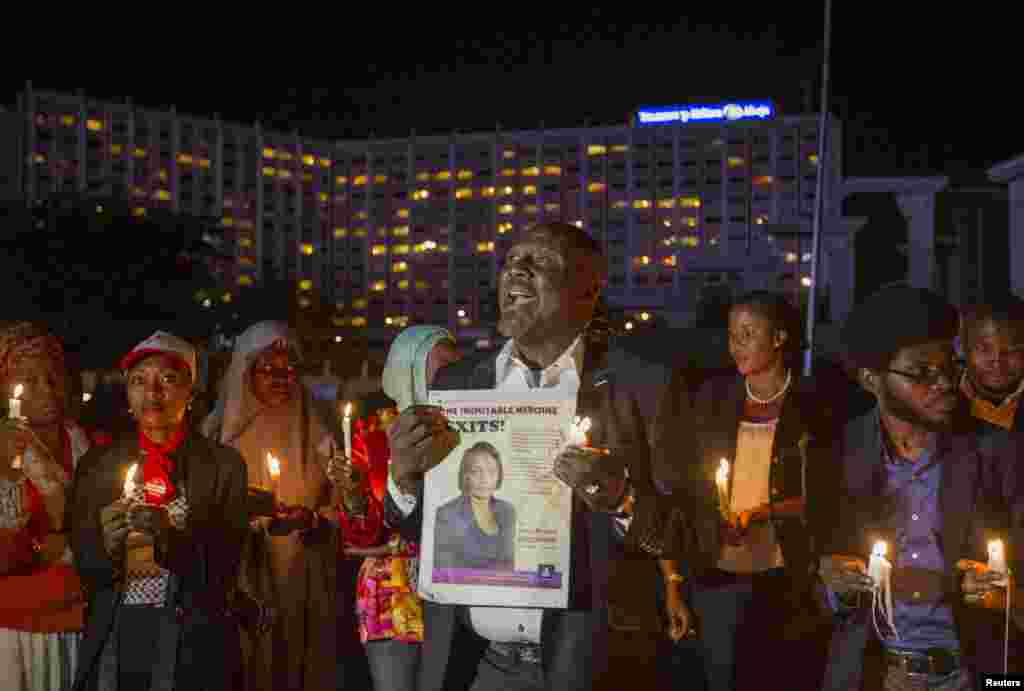 "Bring Back Our Girls" campaigners hold a candle light vigil in tribute for Ameyo Adadevoh and other Ebola victims in Abuja, Aug. 26, 2014.