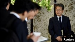 FILE - U.S. Special Representative for North Korea Policy Joseph Yun (R) answers questions from reporters.