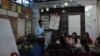 Thorn Bun Thoeng and his students are engaging in a conversation about the exam preparation at his English school. (Soksreinith Ten/VOA Khmer