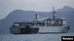 FILE - A Malaysian navy vessel patrols waters near Langkawi Island, May 16, 2015. Malaysia is buying four ships from China to help it patrol its coastline.
