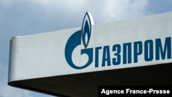FILE - The logo of Russia's energy giant Gazprom is pictured at one of its gasoline stations in Moscow, April 16, 2021.