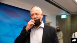 In this Aug. 1, 2021, file photo, Israeli Defense Minister Benny Gantz attends a cabinet meeting at the prime minister's office in Jerusalem. Gantz held talks late Sunday, August 29, 2021, with Palestinian President Mahmoud Abbas.