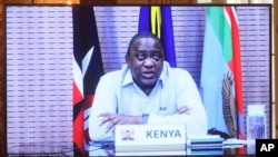 Kenyan President Uhuru Kenyatta appears on a screen as he speaks during a virtual bilateral meeting with Secretary of State Antony Blinken at the State Department in Washington, April 27, 2021. 