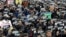 FILE - Demonstrators supporting the MeToo movement in black stage a rally to mark the International Women's Day in Seoul, South Korea, March 8, 2018. 
