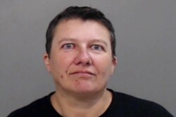 FILE - Pascale Ferrier appears in a jail booking photograph taken after her arrest by the Mission Police Department in Mission, Texas, March 13, 2019.