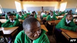 FILE - Girls attending school at Mtitu Secondary School where they live and study during school terms at Kilolo district, approximately 500 kilometers from the Tanzanian capital, Dar-es-Salaam, Sept. 1, 2008. 