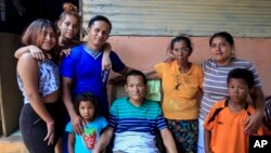 Franklin Perez, 29, wearing a blue jersey, poses with his family in their home, after he was released to house arrest, in Managua, Nicaragua, April 5, 2019. Perez is among the 50 released Friday who had been jailed for protesting against President Daniel Ortega's government.