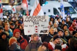 Demonstrators protest closer integration with Russia, which protesters fear could erode the post-Soviet independence of Belarus, in downtown in Minsk, Belarus, Dec. 20, 2019.