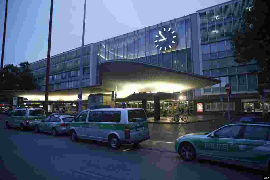 Police vehicles stand outside the main train station following a shooting rampage at the Olympia shopping mall in Munich, Germany July 22, 2016. 
