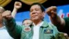 Philippine President Rodrigo Duterte poses with a fist bump during his "Talk with the Airmen" on the anniversary of the 250th Presidential Airlift Wing, Sept. 13, 2016, at the Philippine Air Force headquarters in suburban Pasay city, southeast of Manila. 