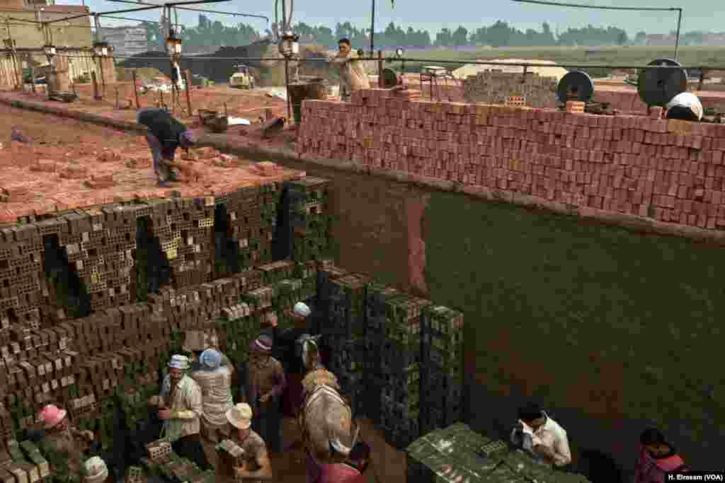 Fertile soil along the Nile’s banks that once produced food now yields bricks. The demand has kept kilns like this — one of 1,320 in Egypt — busy. 