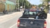 Vehicles are stopped on a highway in Gressiers as armed thugs threaten to target anyone who tries to cross the road. (S. Lemaire/VOA)