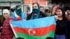 People celebrate on the streets after Azerbaijan's President Ilham Aliyev said the country's forces had taken Shusha, which Armenians call Shushi, during the fighting over the breakaway region of Nagorno-Karabakh, in Baku, Nov. 8, 2020.