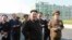 North Korean leader Kim Jong Un gives field guidance at the newly built Wisong Scientists Residential District in this undated photo released by North Korea's Korean Central News Agency (KCNA) in Pyongyang October 14, 2014. Kim, shown using a cane for sup