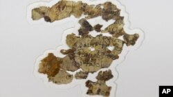The Israel Antiquities Authority displays newly discovered Dead Sea Scroll fragments at the Dead Sea scrolls conservation lab in Jerusalem, Tuesday, March 16, 2021. (AP Photo/Sebastian Scheiner)