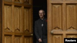 The Bishop of Durham, and the newly appointed Archbishop of Canterbury, Justin Welby, leaves after a news conference at Lambeth Palace, in London, November 9, 2012.