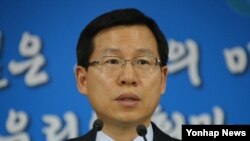 Policemen use their shields during the demolition of an informal settler community in Manila, Philippines, to redevelop the area into a business district in a joint venture with a private firm. Some 500 families were affected by the demolition.