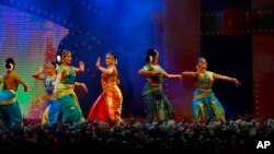 FILE - Indian dancers perform classical dance at the opening ceremony of Bengaluru International Film Festival (BIFFES), at the lawns of Vidhana Soudha, the seat of the state legislature of India's southern state of Karnataka, Bangalore, Jan. 28, 2016.
