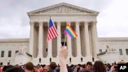 FILE - A crowd celebrates outside of the Supreme Court after the court declared that same-sex couples have a right to marry anywhere in the United States, in Washington, D.C., June 26, 2015.