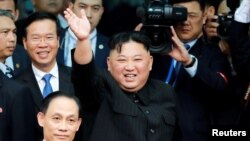 North Korean leader Kim Jong Un bids farewell to the crowd before boarding his train to depart for North Korea at Dong Dang railway station in Vietnam, March 2, 2019. 