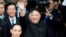 North Korean leader Kim Jong Un bids farewell to the crowd before boarding his train to depart for North Korea at Dong Dang railway station in Vietnam, March 2, 2019. 