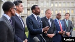 A group of U.S. mayors and mayors-elect after a White House meeting with President Joe Biden, in Washington, Dec. 14, 2021. 