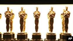 FILE - Oscar statuettes appear backstage at the Oscars in Los Angeles. 