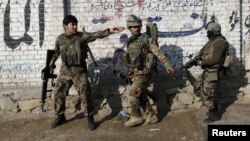 Afghan National Army (ANA) soldiers arrive after a blast near the Pakistani consulate in Jalalabad, Afghanistan, Jan. 13, 2016.