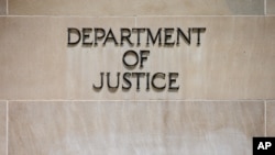 FILE - Robert F. Kennedy Department of Justice Building.