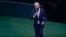 FILE - President Joe Biden takes off his mask as he walks from Marine One on the South Lawn of the White House in Washington, Oct. 5, 2021, after returning from a trip to Michigan to promote his infrastructure plan.