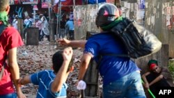 Protesters of Bangladesh's quota system for government jobs clash with students who back the ruling Awami League party in Dhaka on July 16, 2024.