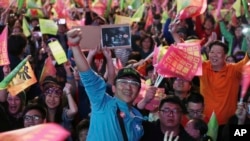 Supporters of Taiwan's 2020 presidential election candidate, Taiwan president Tsai Ing-wen cheer for Tsai's victory in Taipei, Taiwan, Jan. 11, 2020.