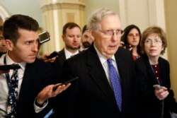 FILE - Senate Majority Leader Mitch McConnell of Kentucky speaks with reporters on Capitol Hill in Washington, Dec. 19, 2019.
