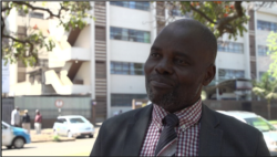 Kingstone Magombeyi, the father of Dr. Peter Magombeyi, acting president of the Zimbabwe Hospital Doctors Association, speaks in Harare, Sept. 26, 2019. (C. Mavhunga/VOA)