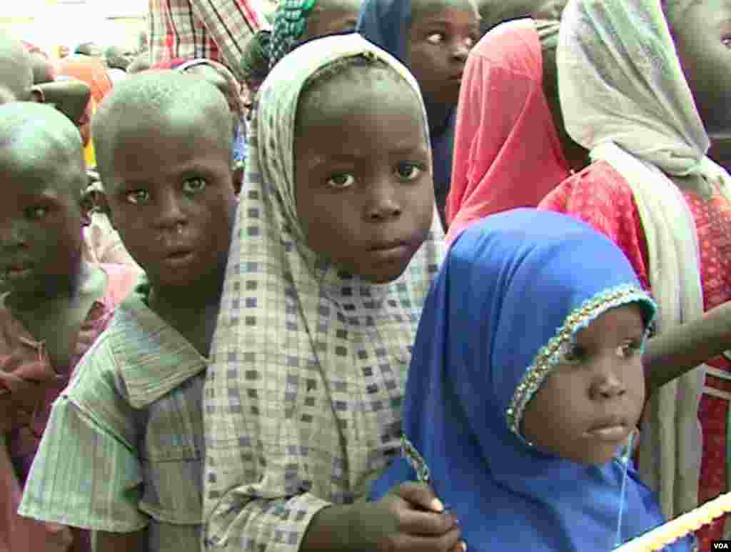 Children line up to enroll at school in Fotokol, Cameroon. (M.E. Kinzeka/VOA)