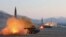 FILE - North Korea launches four missiles in an undisclosed location North Korea in this file image made from video released by KRT on March 7, 2017.