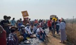 Protesters opposed to the military coup block the railway between Yangon and the southern city of Mawlamyine, Myanmar Feb. 16, 2021, in this still image taken from social media video. (Credit: Than Lwin Times Media)