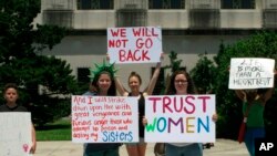 Abortion rights supporters protest at the Louisiana Capitol, where lawmakers were considering a bill that would ban abortion at as early as six weeks of pregnancy.
