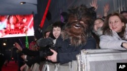 Fans gather ahead of the premiere of the film 'Star Wars: The Last Jedi' in London, Dec. 12, 2017. 