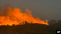This photo released by the Arizona Department of Forestry and Fire Management shows smoke rising from the Boulder View fire on June 27, 2024, near Phoenix.