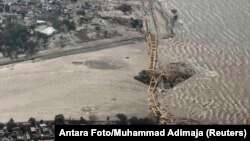 An aerial view shows a bridge damaged by an earthquake and tsunami in Palu, Central Sulawesi, Indonesia, Sept. 29, 2018. 
