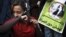 An Egyptian woman cuts her hair during a demonstration in Tahrir Square, Cairo, Egypt, Dec. 25, 2012. 