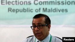 FILE - Maldives Election Commissioner Fuwad Thowfeek speaks during a news conference in Male, Oct. 18, 2013. 