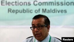 FILE - Maldives Election Commissioner Fuwad Thowfeek speaks during a news conference in Male, October 18, 2013. 
