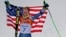 Men's giant slalom gold medalist Ted Ligety of the United States poses for photographers on the podium at the Sochi 2014 Winter Olympics, in Krasnaya Polyana, Russia, Feb. 19, 2014.