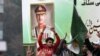 Supporters of the hardliner Tehreek e Labbaik Pakistan (TLP) party take part in a protest rally in front of a picture of Pakistan's Army Chief General Syed Asim Munir in Lahore, Feb. 10, 2024 amid claims the election result delay is allowing authorities to rig the vote-counting. 